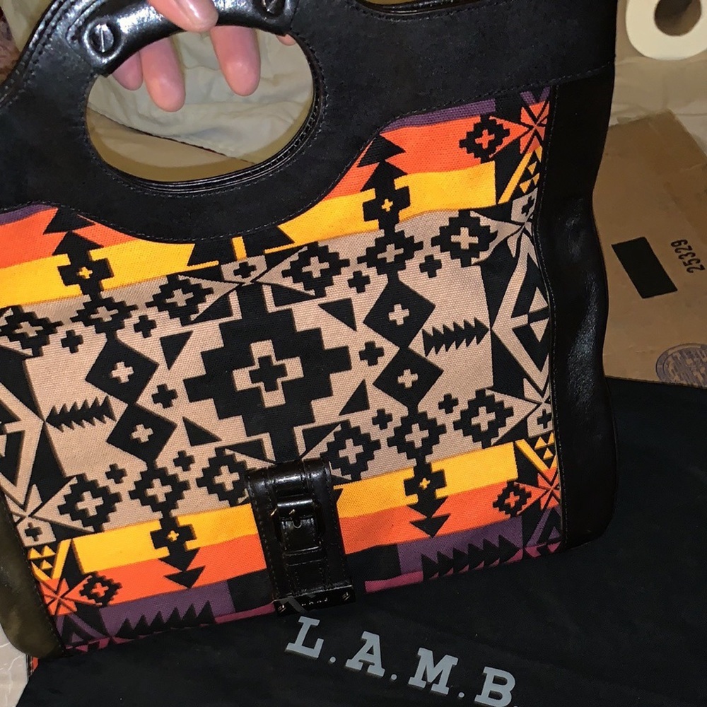 Authentic L.A.M.B. Reversible clutch.